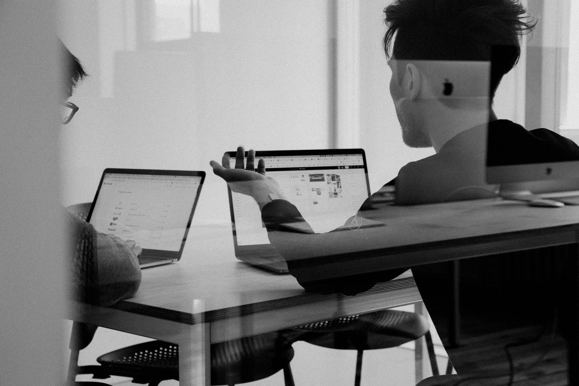 two men arguing over macbook